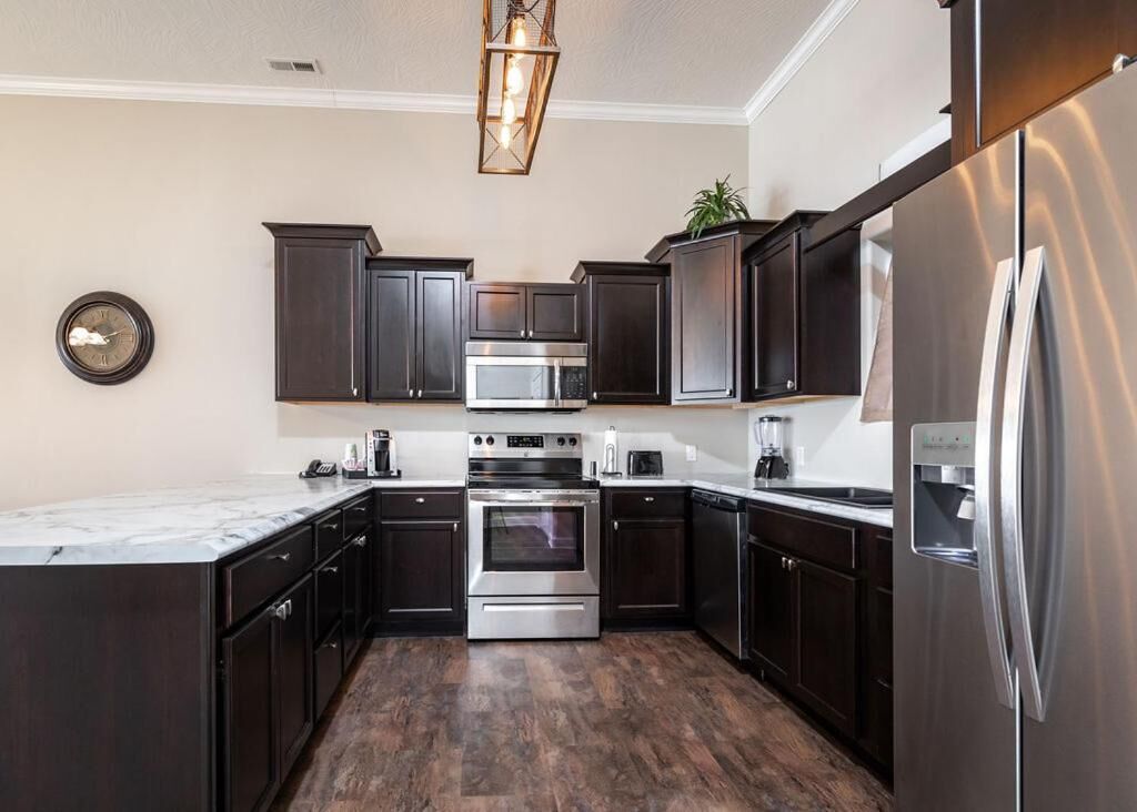 microwave, coffee/tea maker, toaster, cookware/dishes/utensils