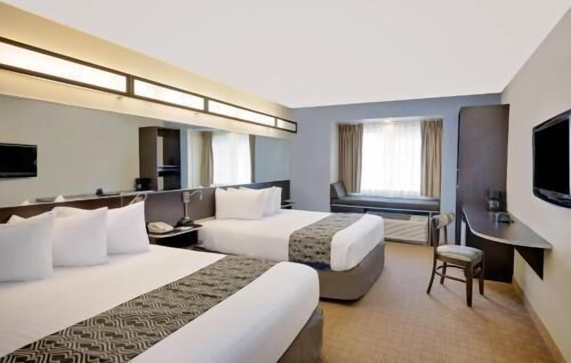 Premium bedding, pillow-top beds, in-room safe, desk