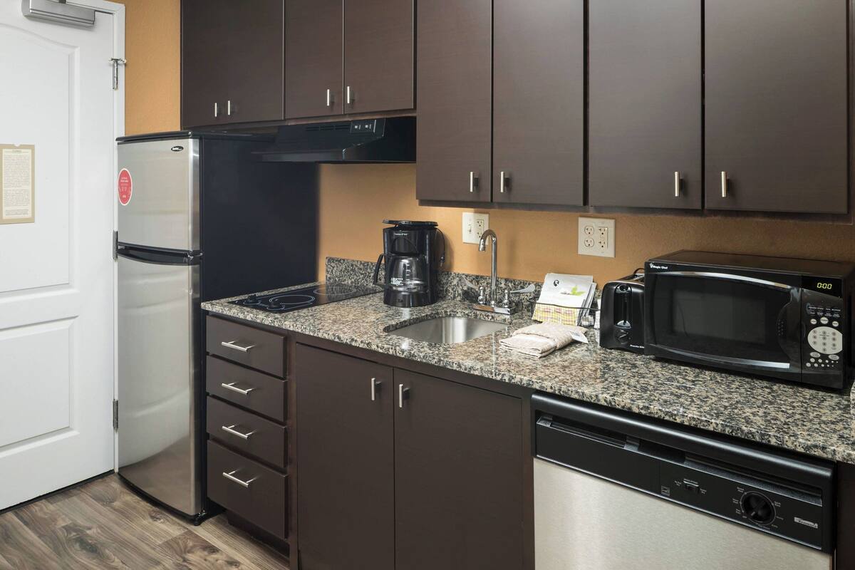 studio, 1 queen bed with sofa bed | private kitchen | fridge, microwave, stovetop, dishwasher