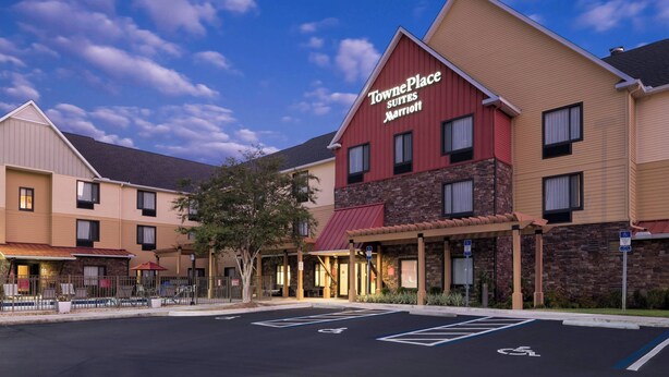 TownePlace Suites by Marriott with a parking lot, accessible entrance, and a building facade with a mix of beige and red colors. - TownePlace Suites by Marriott Panama City (Panama City)