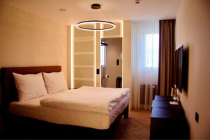 Premium bedding, memory foam beds, in-room safe, desk