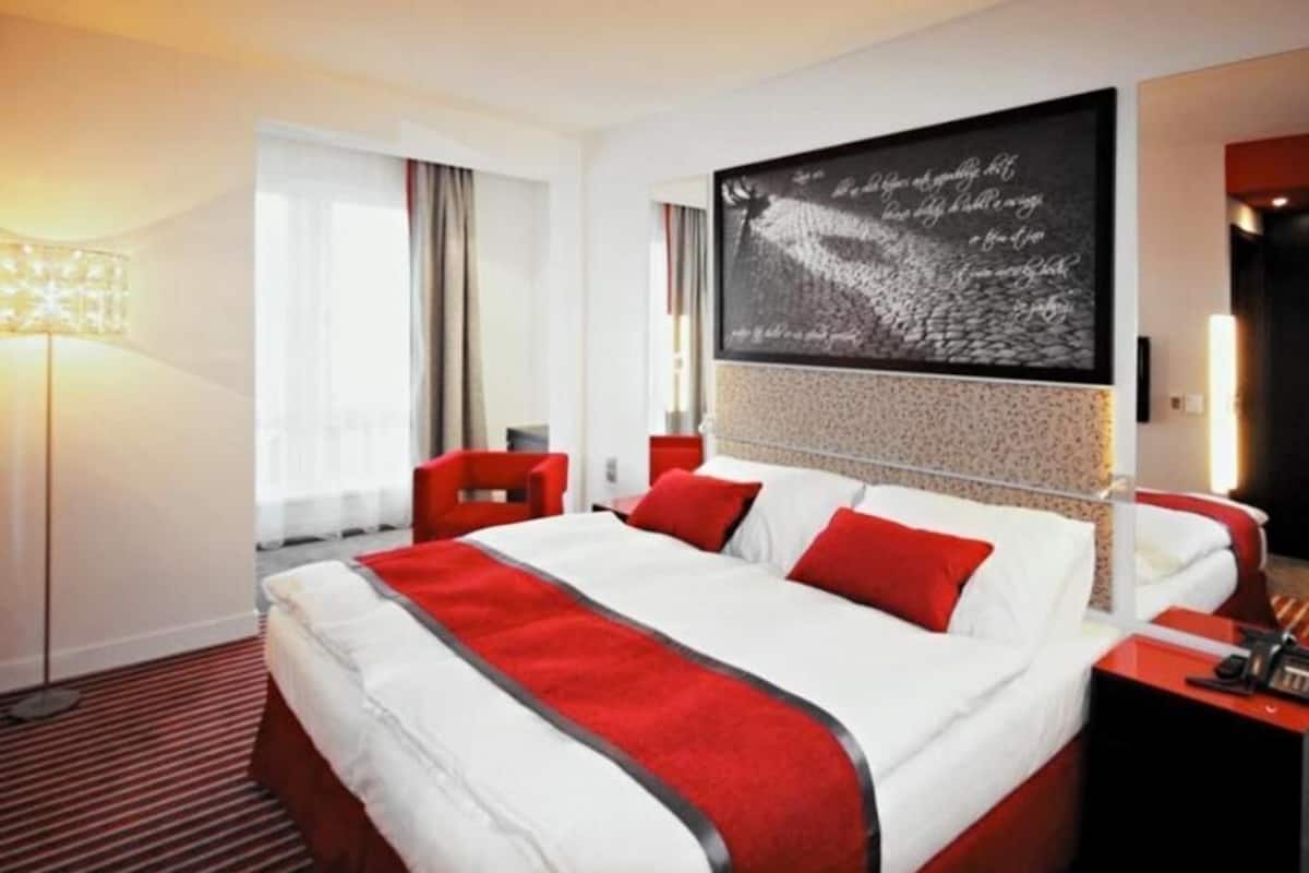 Premium bedding, memory-foam beds, in-room safe, desk