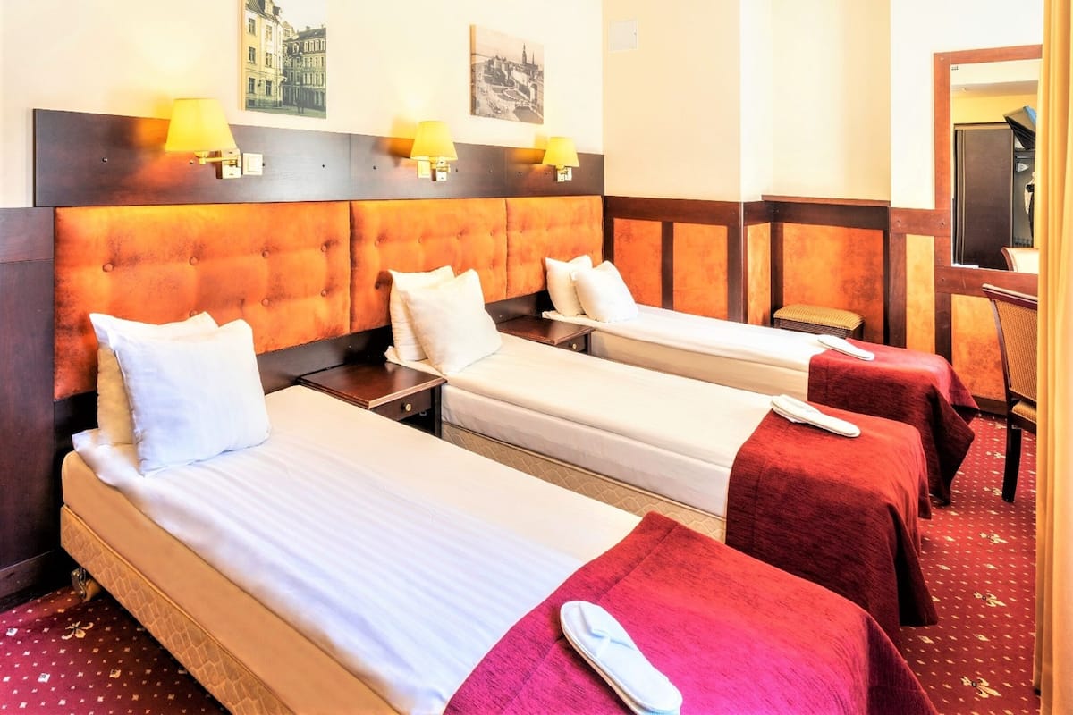 Standard Triple Room, 3 Single Beds | Minibar, in-room safe, desk, laptop workspace