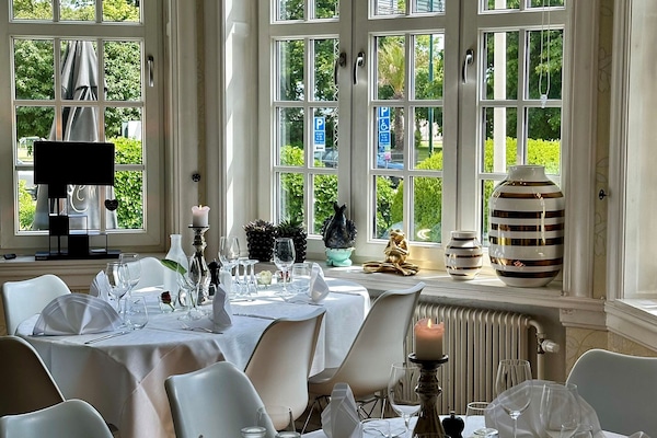 Breakfast, lunch served; local and international cuisine, garden views