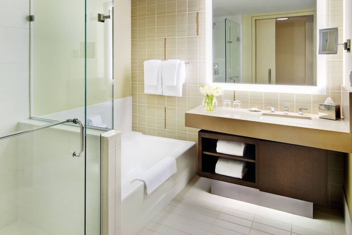 separate bathtub and shower, deep-soaking bathtub, designer toiletries