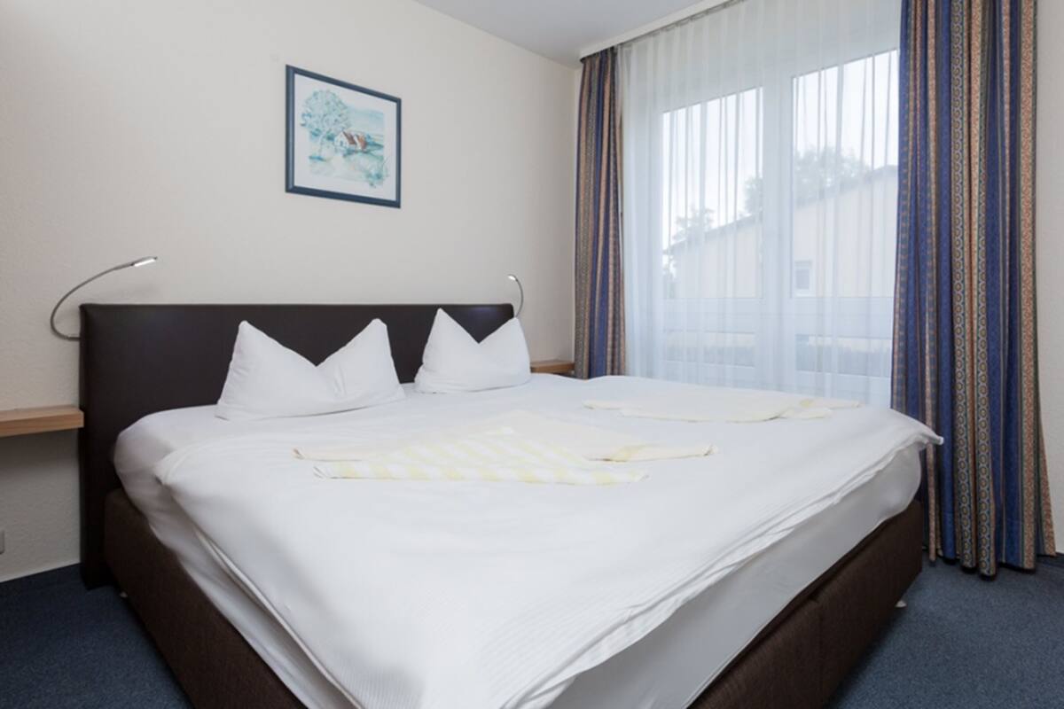 Apartment, 1 Bedroom, Balcony | Living area | 32-inch flat-screen TV with cable channels, TV