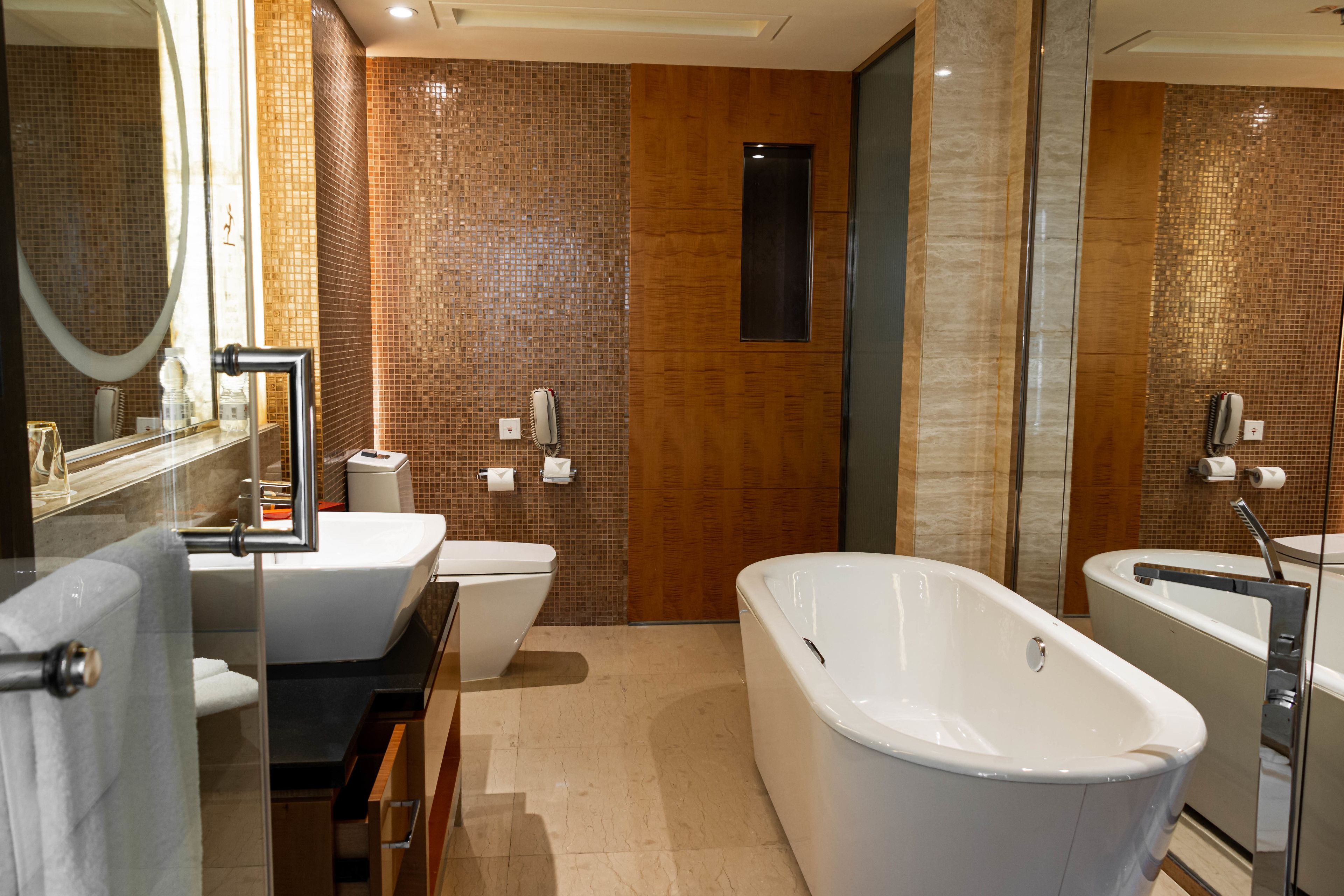 separate bathtub and shower, hair dryer, bathrobes, slippers