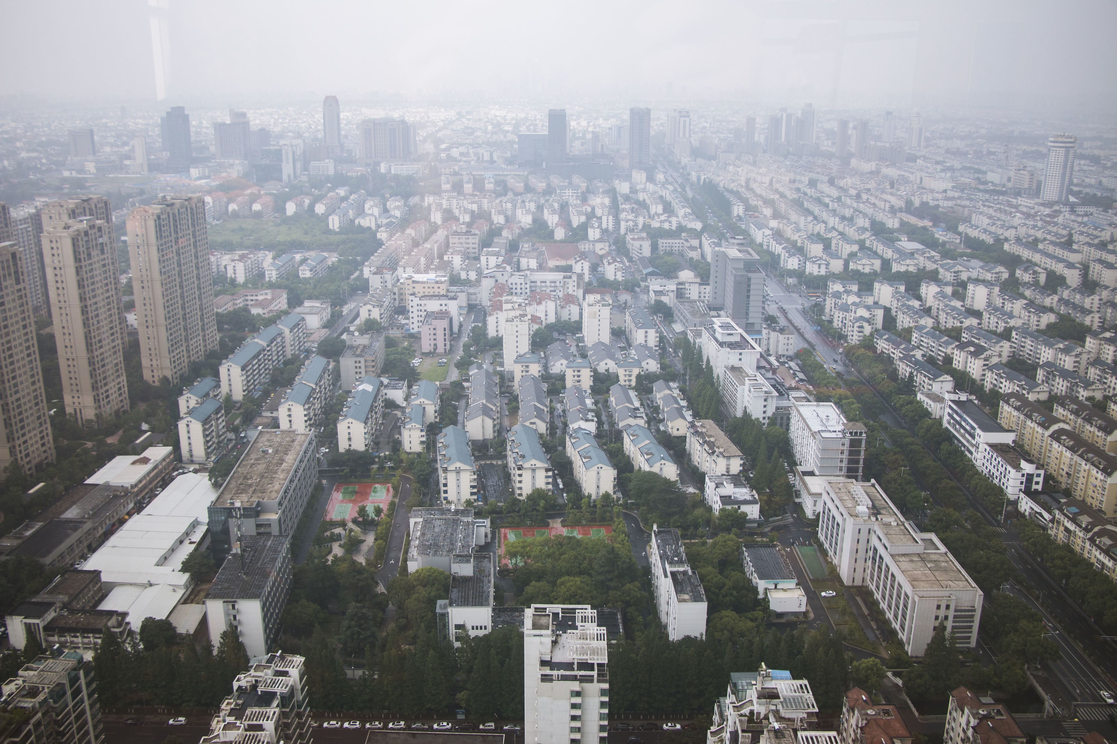 A high-rise building with multiple floors and a dense urban environment.