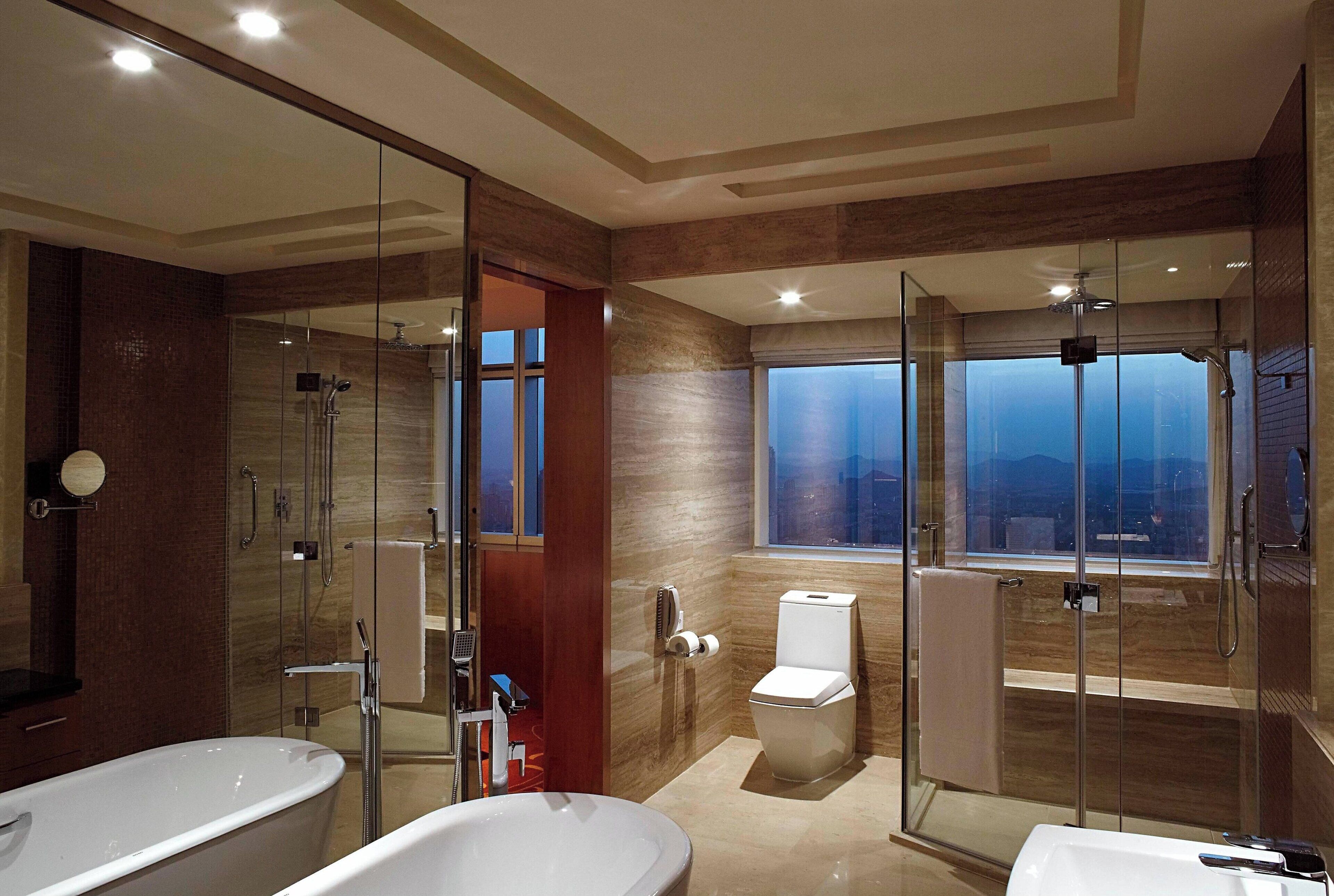 separate bathtub and shower, hair dryer, bathrobes, slippers