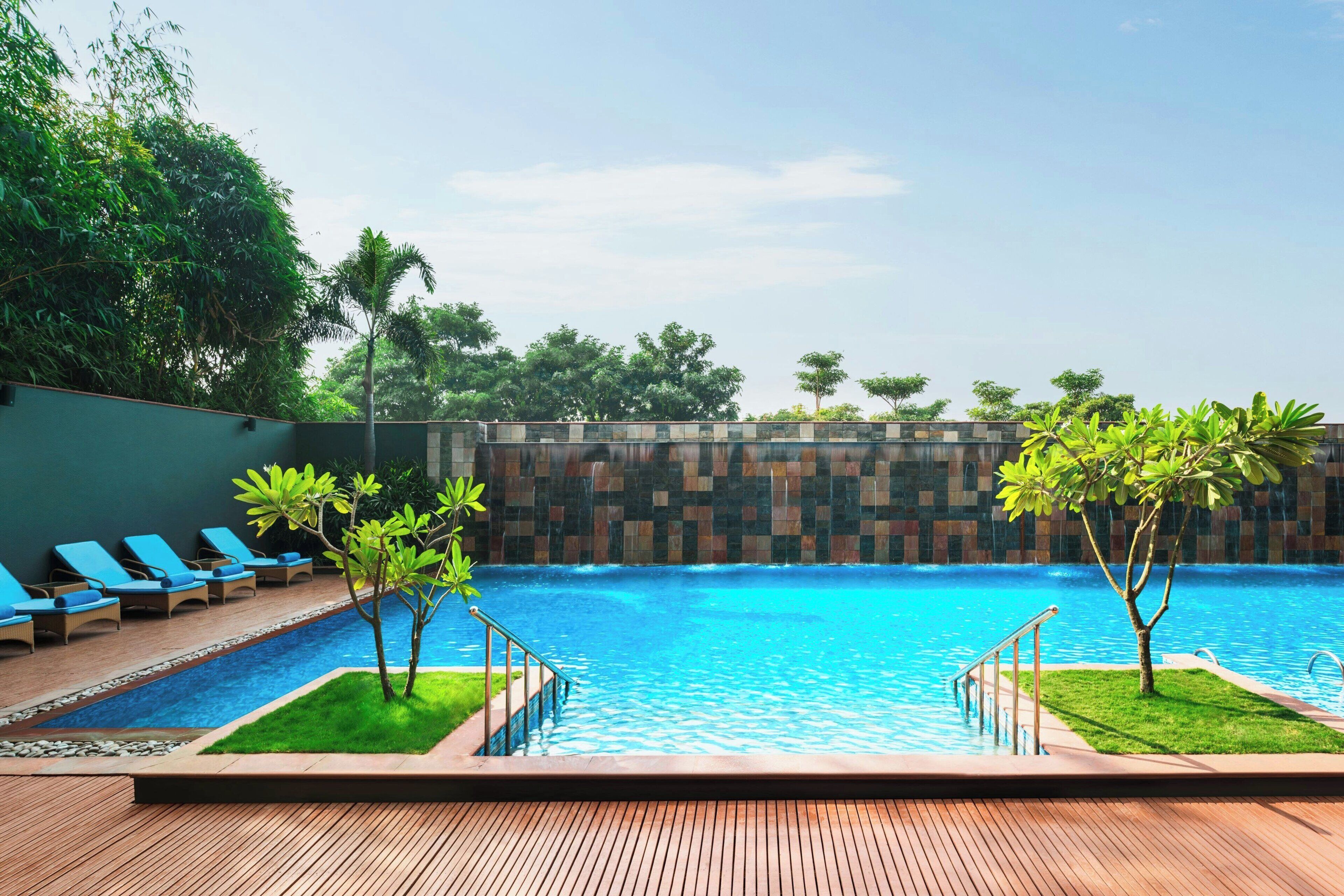 Outdoor pool, open 6:00 AM to 10:00 PM, pool umbrellas, sun loungers