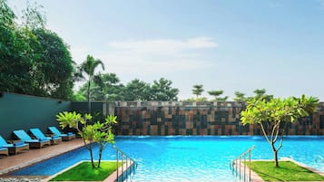 Outdoor pool, open 6:00 AM to 10:00 PM, pool umbrellas, pool loungers