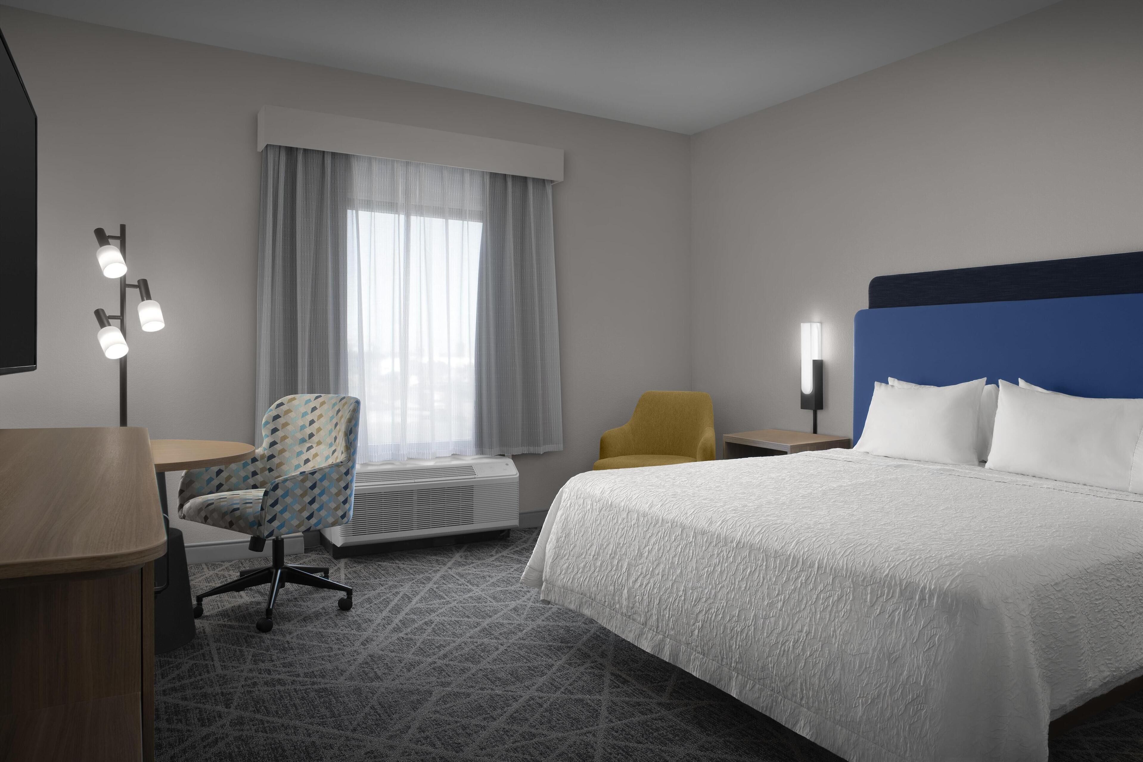 room, 1 king bed | in-room safe, desk, iron/ironing board, free cots/infant beds