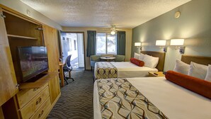 A hotel room with two beds, a television, a desk, and a view of the outdoors. - Super 8 by Wyndham Florence OR (Florence)