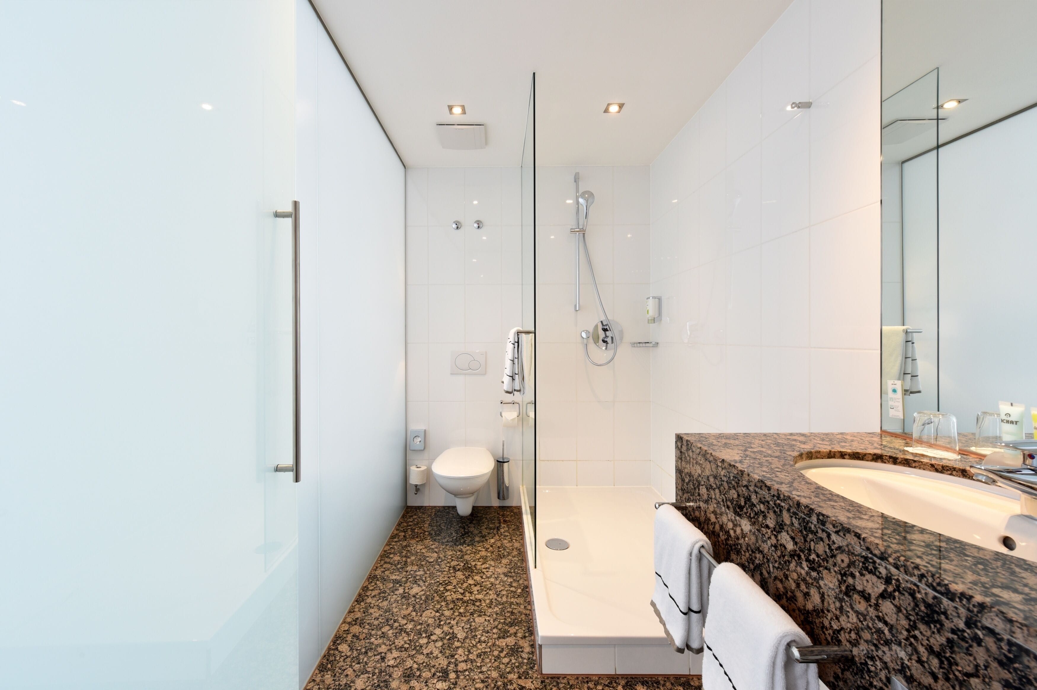 superior double room | bathroom | shower, eco-friendly toiletries, hair dryer, bathrobes