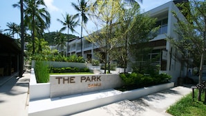 A modern building with a sign reading "THE PARK SAMUI." - The Park Samui (Koh Samui)
