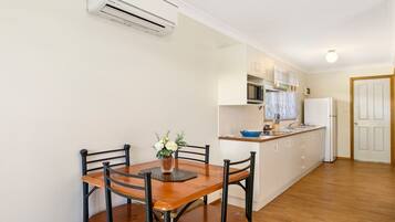 Full-sized fridge, microwave, stovetop, coffee/tea maker