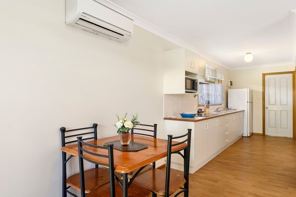 Full-sized fridge, microwave, stovetop, coffee/tea maker