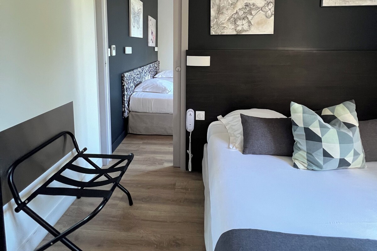 Family Suite, 2 Bedrooms | Desk, blackout drapes, soundproofing, iron/ironing board (on request)