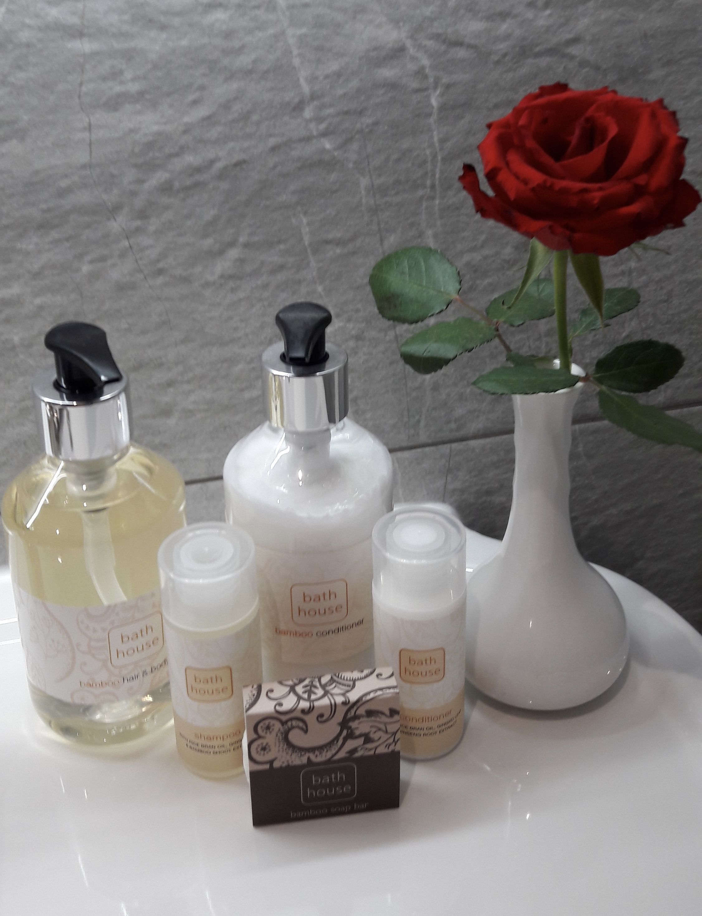 designer toiletries, hair dryer, towels