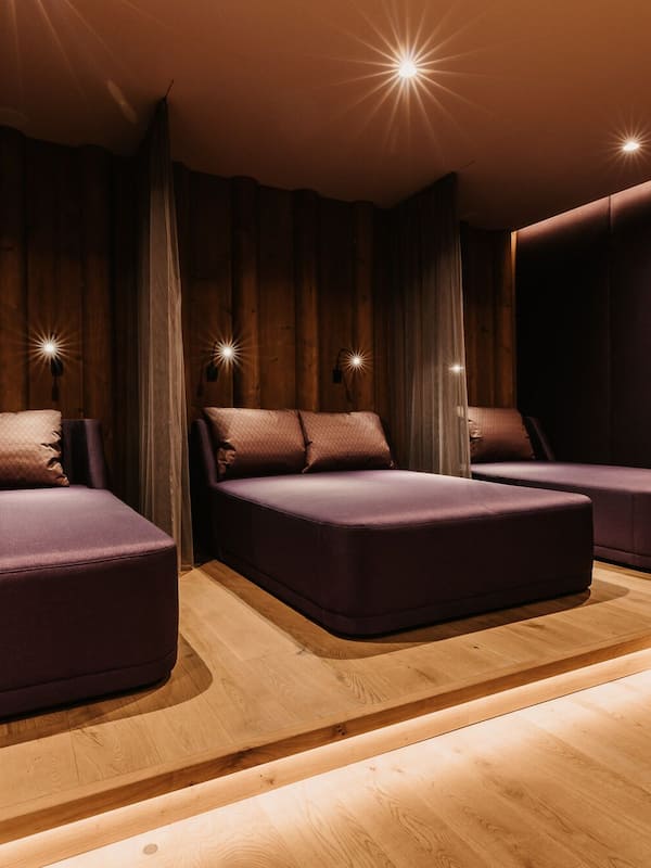 Relax in a serene space with a cushioned bench and pillow in each of three distinct seating areas.