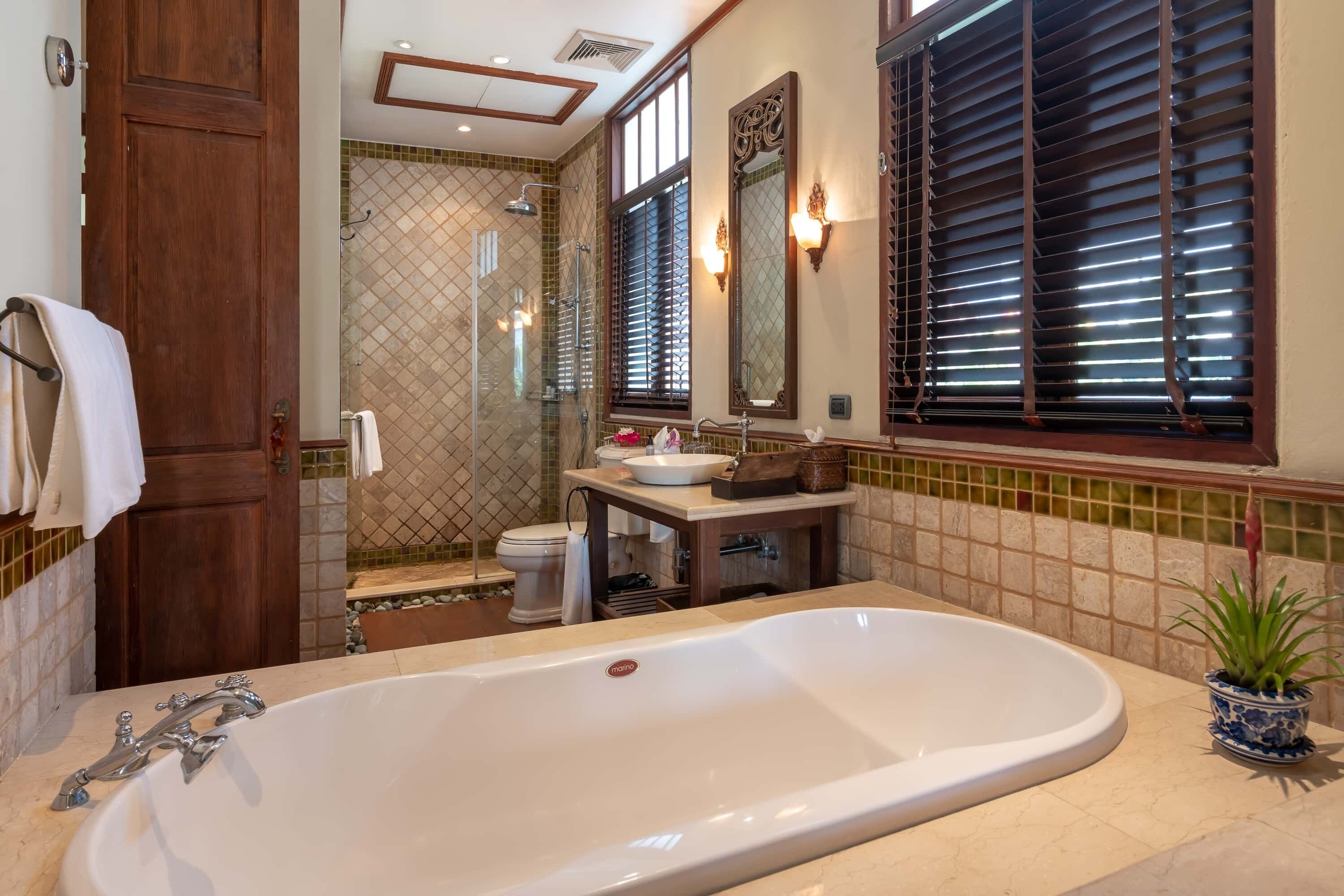 executive deluxe | bathroom | separate bathtub and shower, designer toiletries, hair dryer, bathrobes