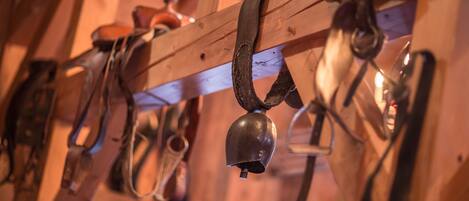 A wooden structure with metal bells hanging from it.