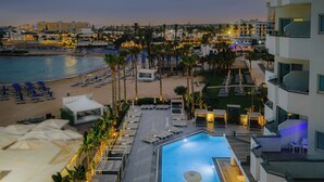A hotel with a pool, beach, and palm trees. - Tasia Maris Sands - Adults Only (Ayia Napa)