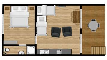 A hotel room layout with a bed, two sofas, a dining table, and a kitchen area.