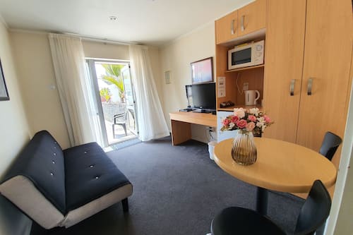 Suite - 1 Bedroom | Living area | 40-inch TV with digital channels