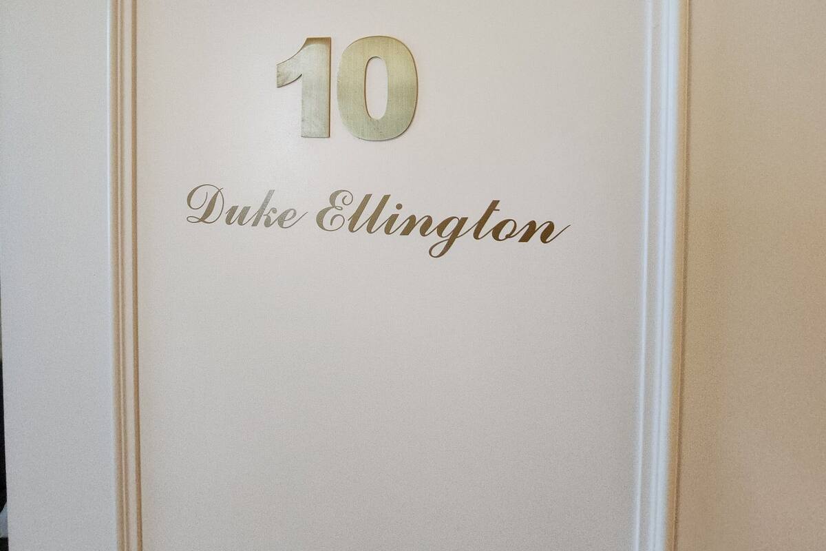A door with the number 10 and the name 'Duke Ellington' in gold lettering.