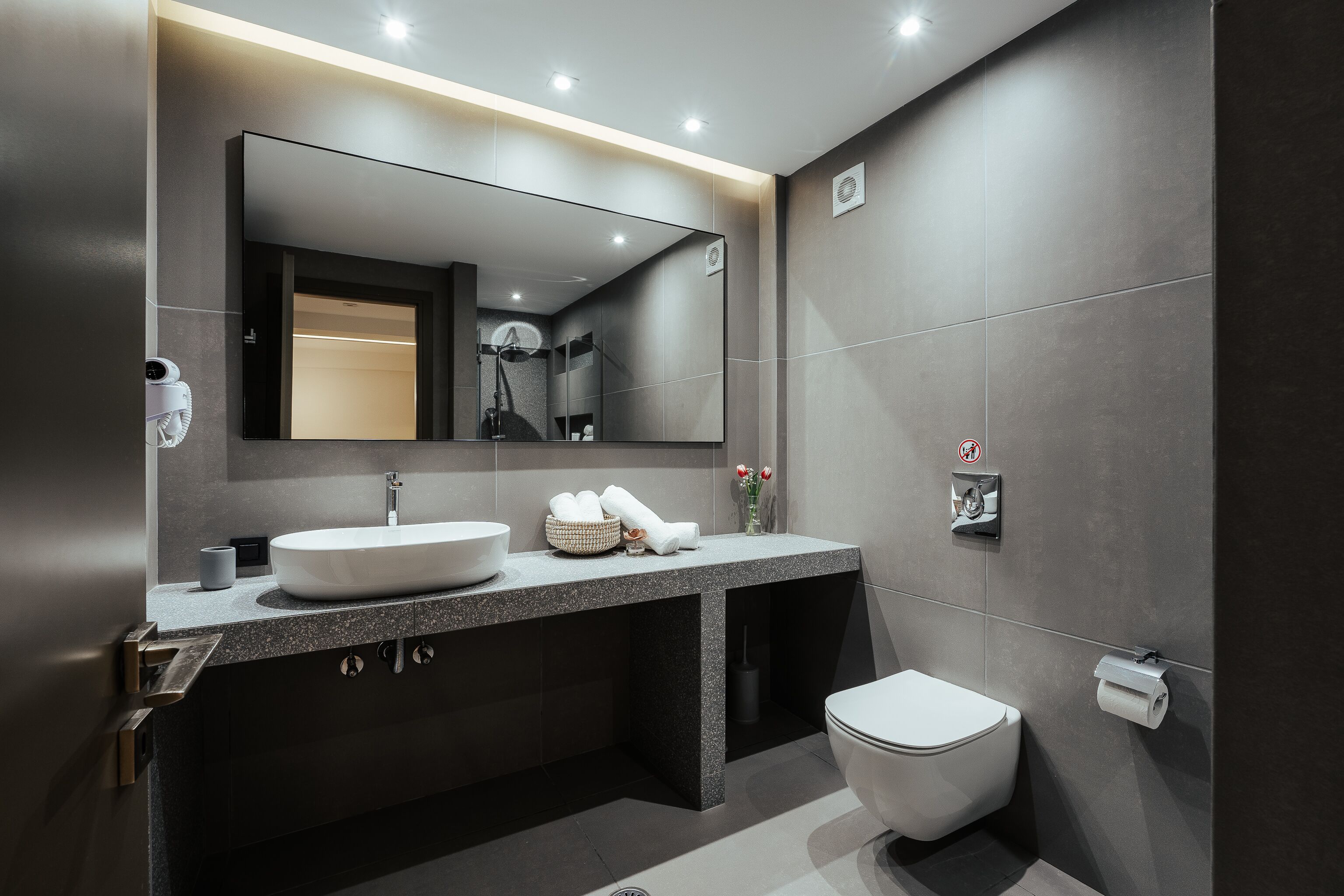 luxury apartment, ground floor | bathroom | designer toiletries, hair dryer, slippers, towels