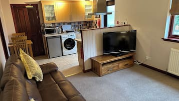 Courtyard Flat | Area keluarga | TV, pemutar DVD, dan stasiun docking iPod