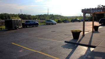 A parking lot with a covered area labeled "OFFICE".