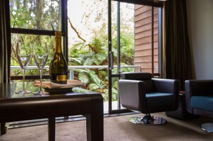 Deluxe Room, 1 King Bed | Living area | LCD TV, MP3 dock