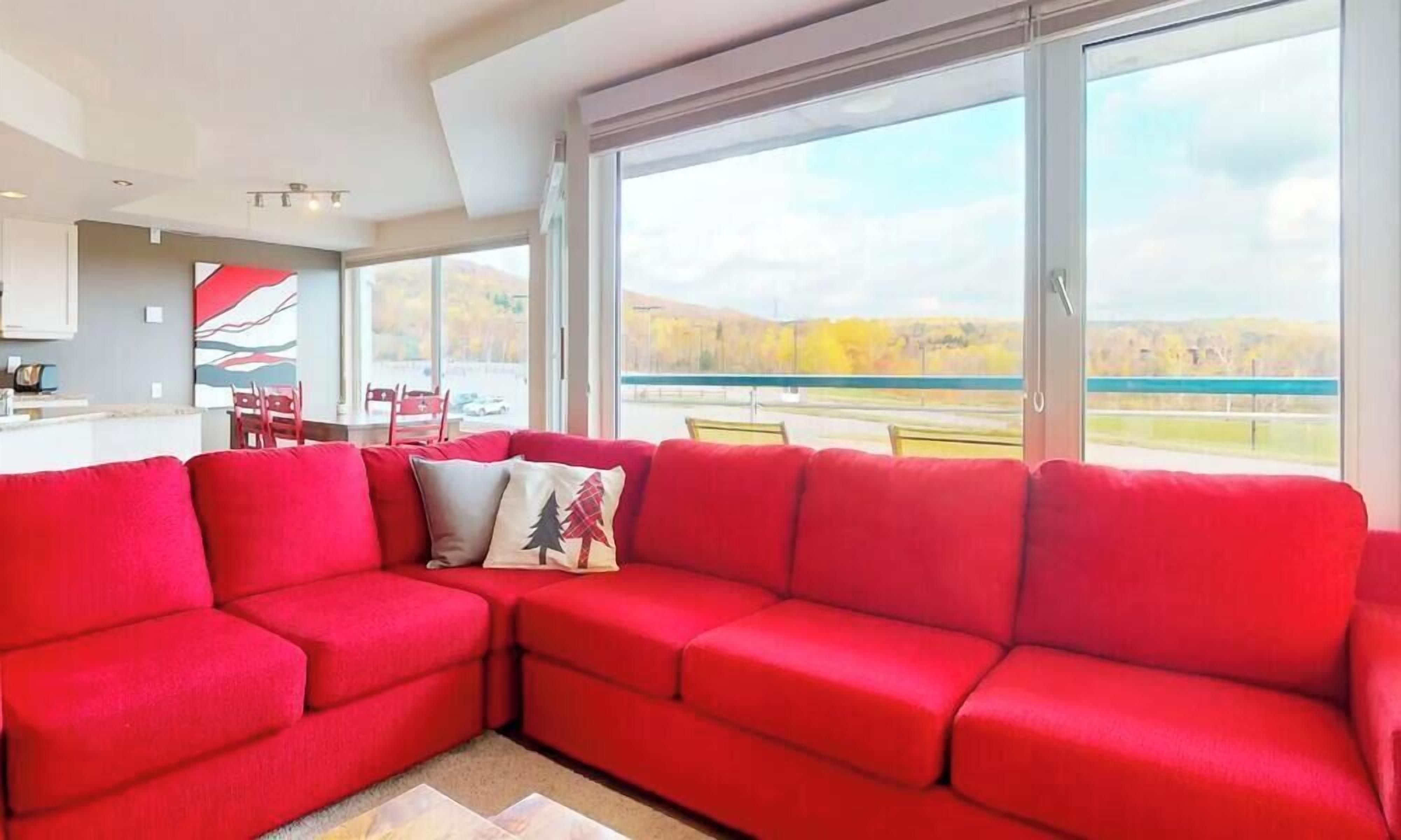 Family Apartment, 3 Bedrooms | Living area | 32-inch TV with cable channels