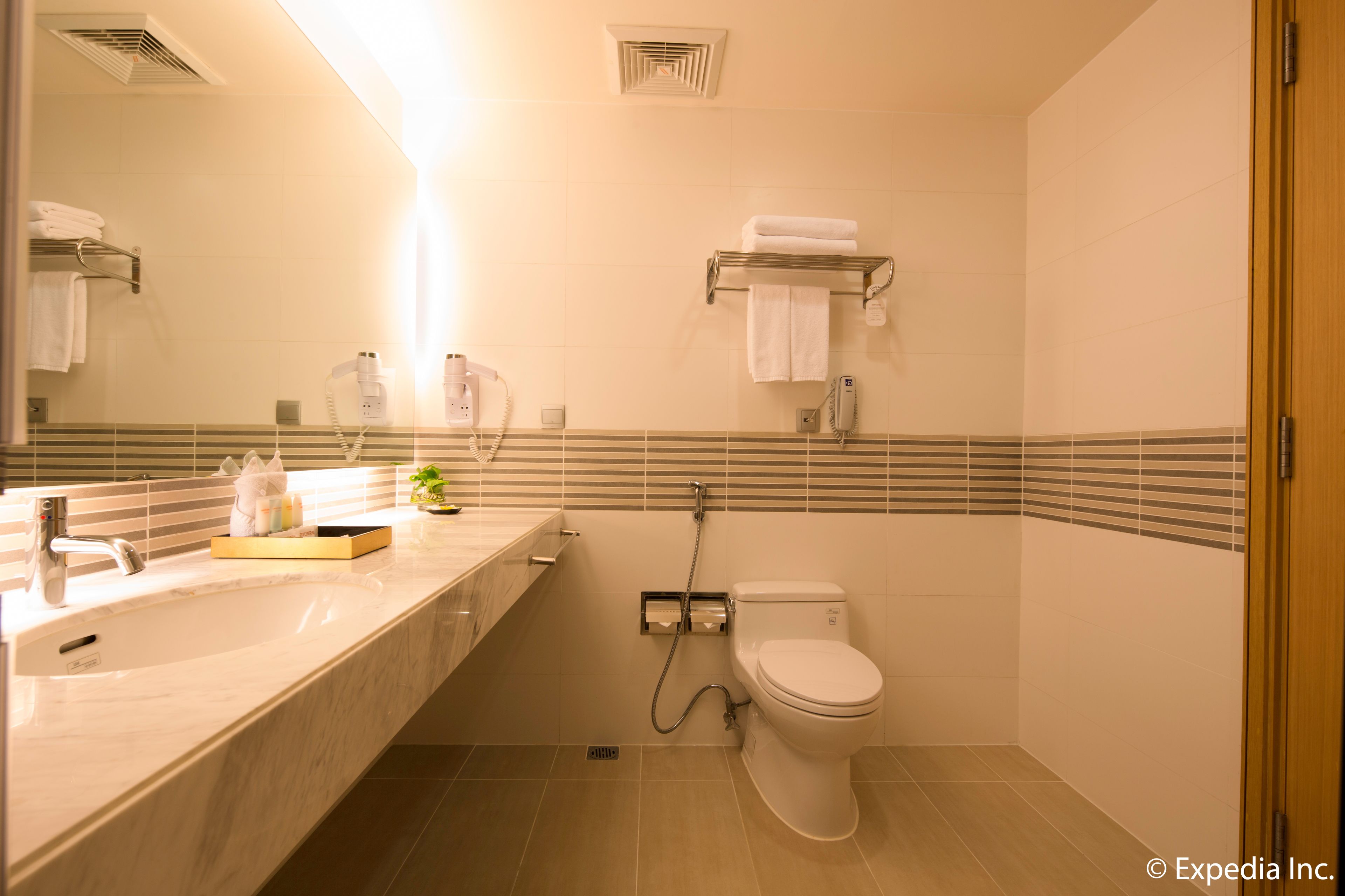 signature room | bathroom | eco-friendly toiletries, hair dryer, slippers, bidet