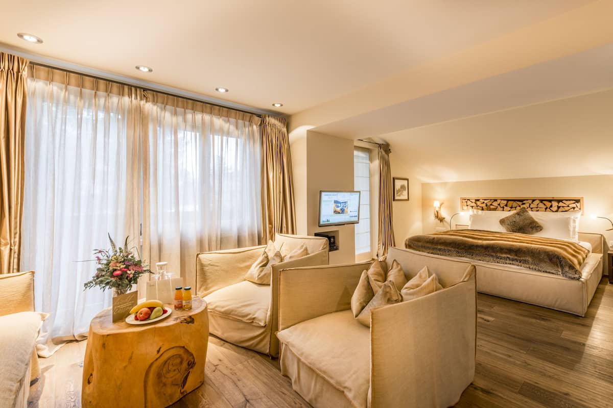 design suite, 1 double bed, fireplace, mountain view | 1 bedroom, premium bedding, in-room safe, blackout curtains