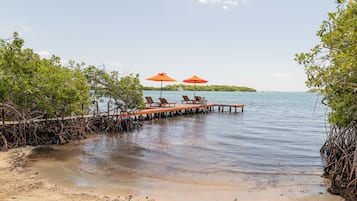 Private beach, white sand, sun loungers, beach umbrellas