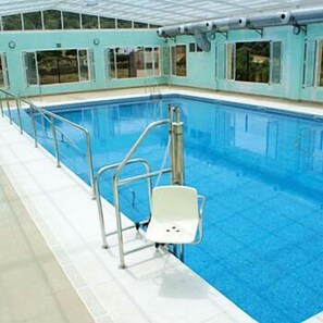 Indoor pool, open 8:00 AM to 10:00 PM, pool loungers