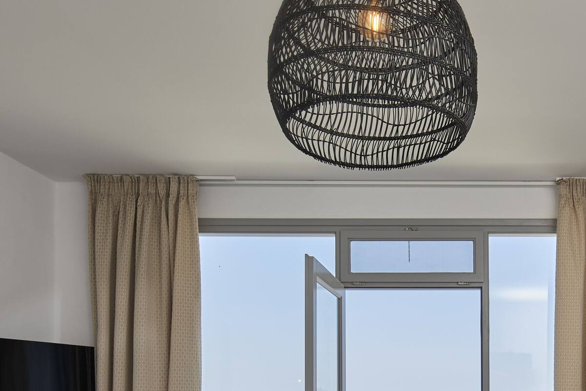 two bedroom villa with indoor private cave pool | living area | flat-screen tv, dvd player, computer