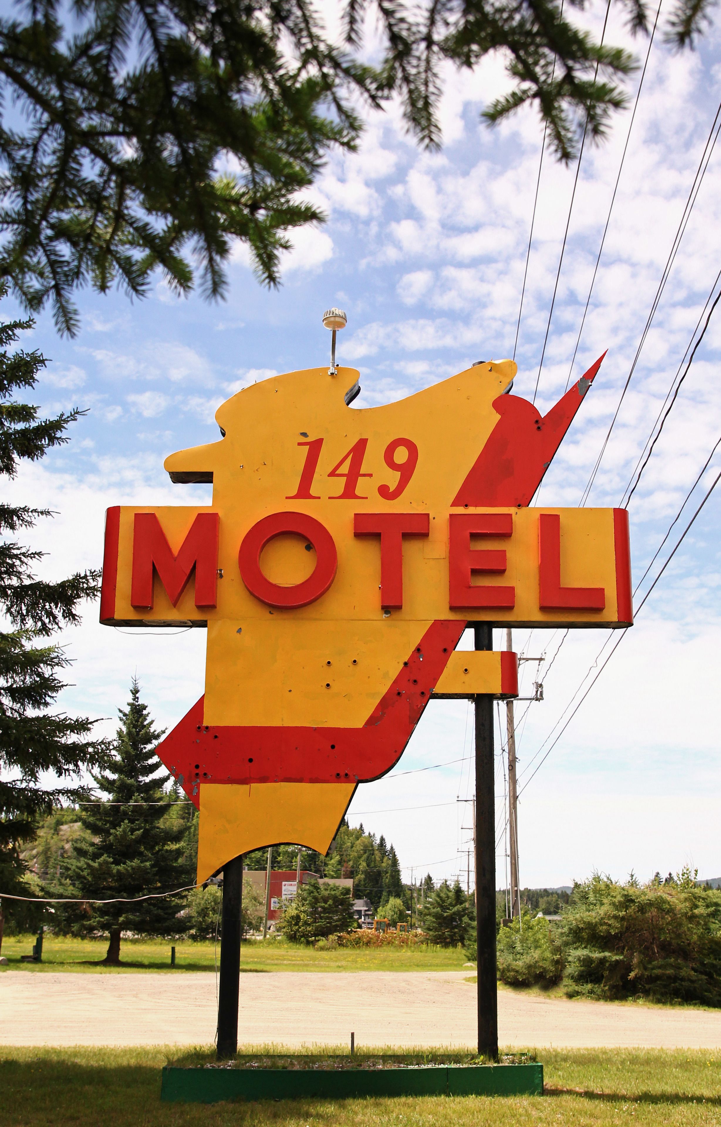 A motel sign with the number 149 and the word "MOTEL" in bold letters.