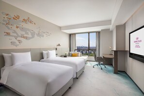 Premium bedding, down comforters, pillowtop beds, minibar