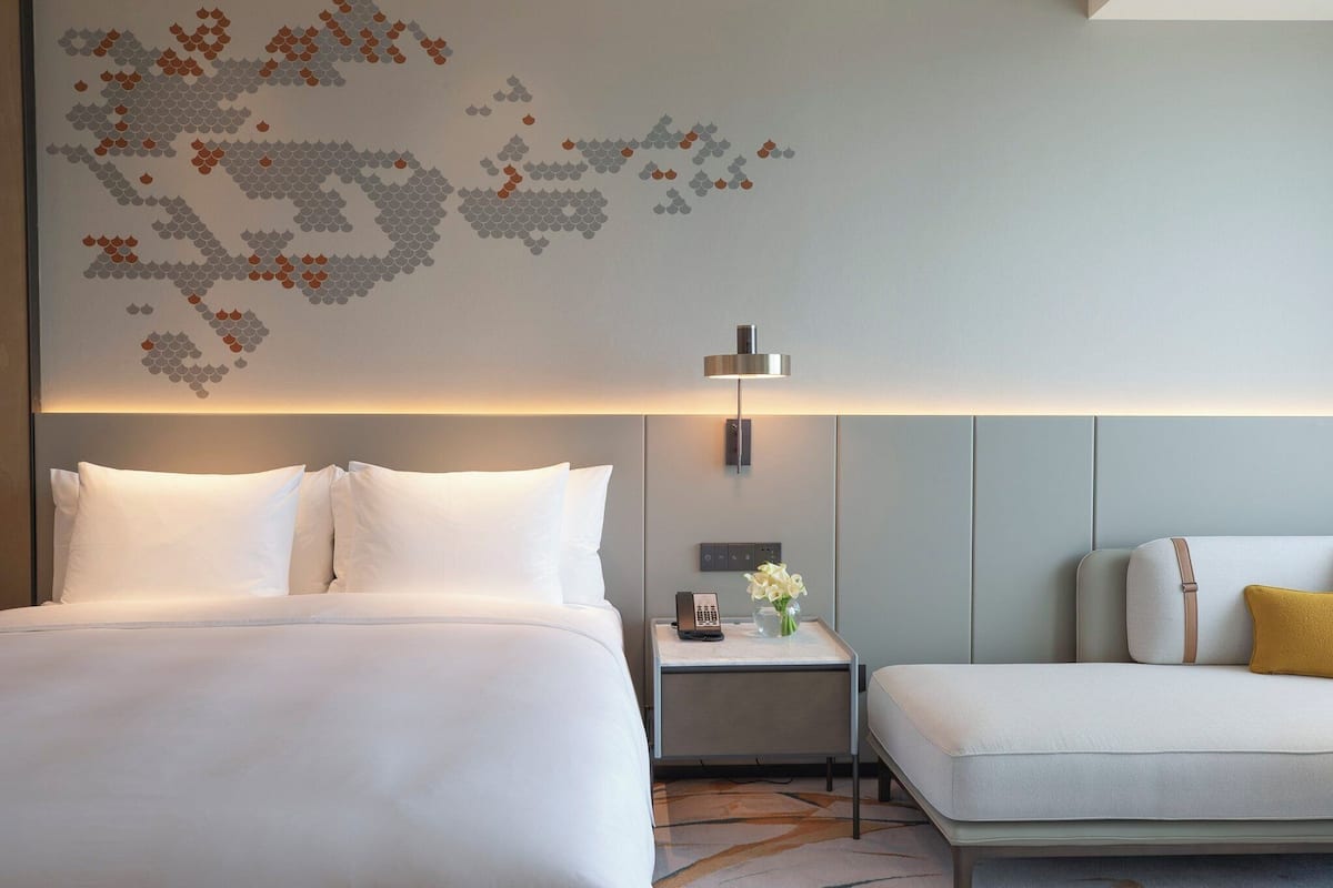 Premium bedding, down comforters, pillowtop beds, minibar