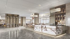 A modern hotel lobby with a marble reception desk, a wine cellar, and a dining area. - Crowne Plaza Shanghai Jinxiu by IHG (Shanghai)