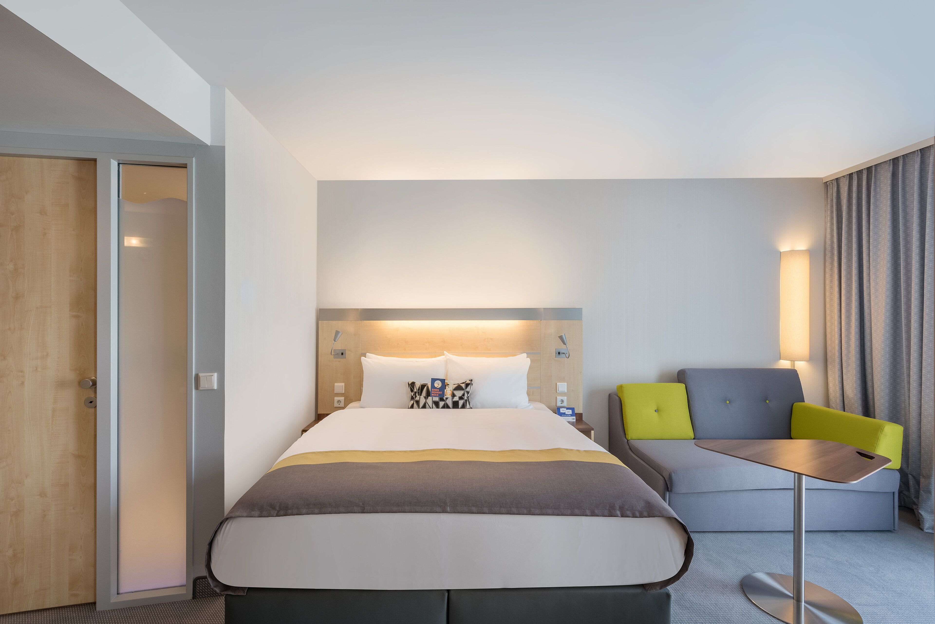 hypo-allergenic bedding, desk, laptop workspace, blackout curtains