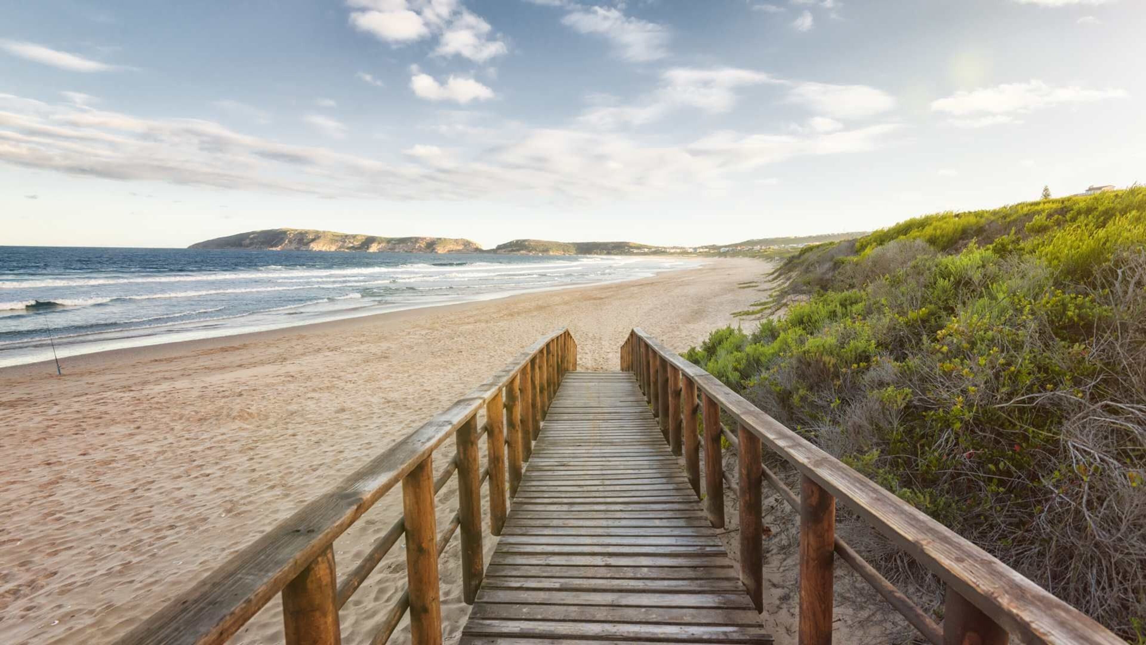 Beach nearby, white sand, beach towels