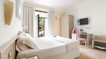Habitación individual Deluxe | Edredón, camas con efecto memoria y minibar
