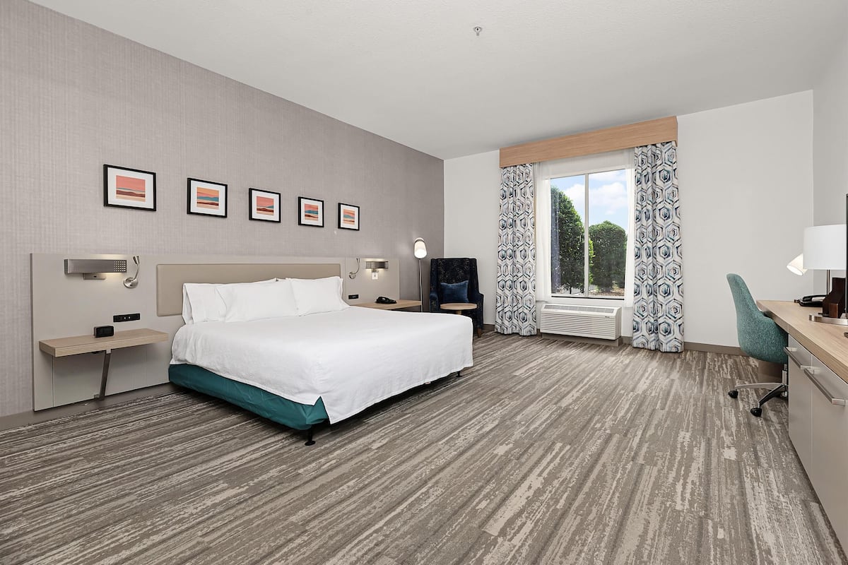 Desk, laptop workspace, blackout drapes, iron/ironing board