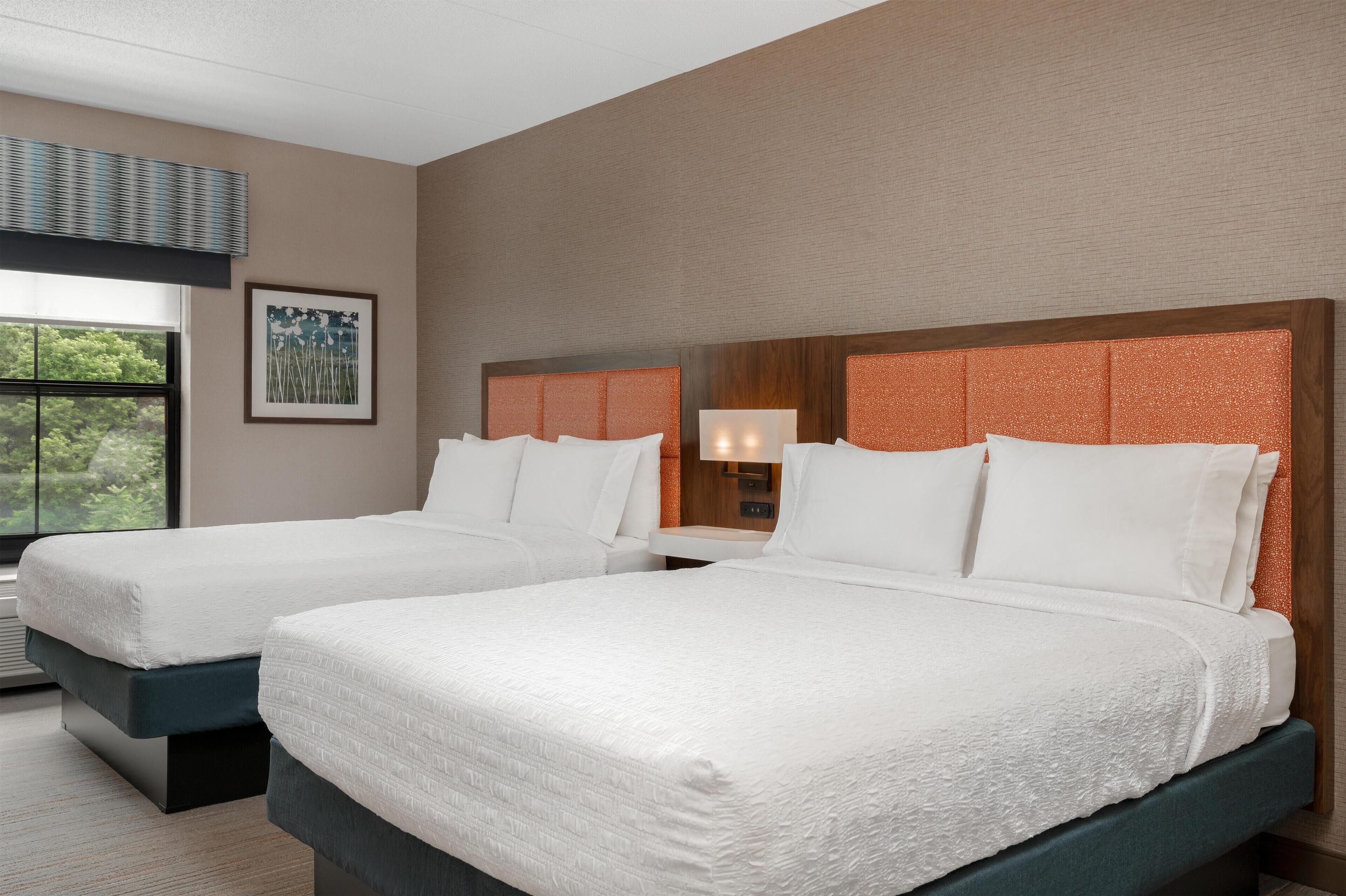 two queens | premium bedding, desk, laptop workspace, blackout curtains