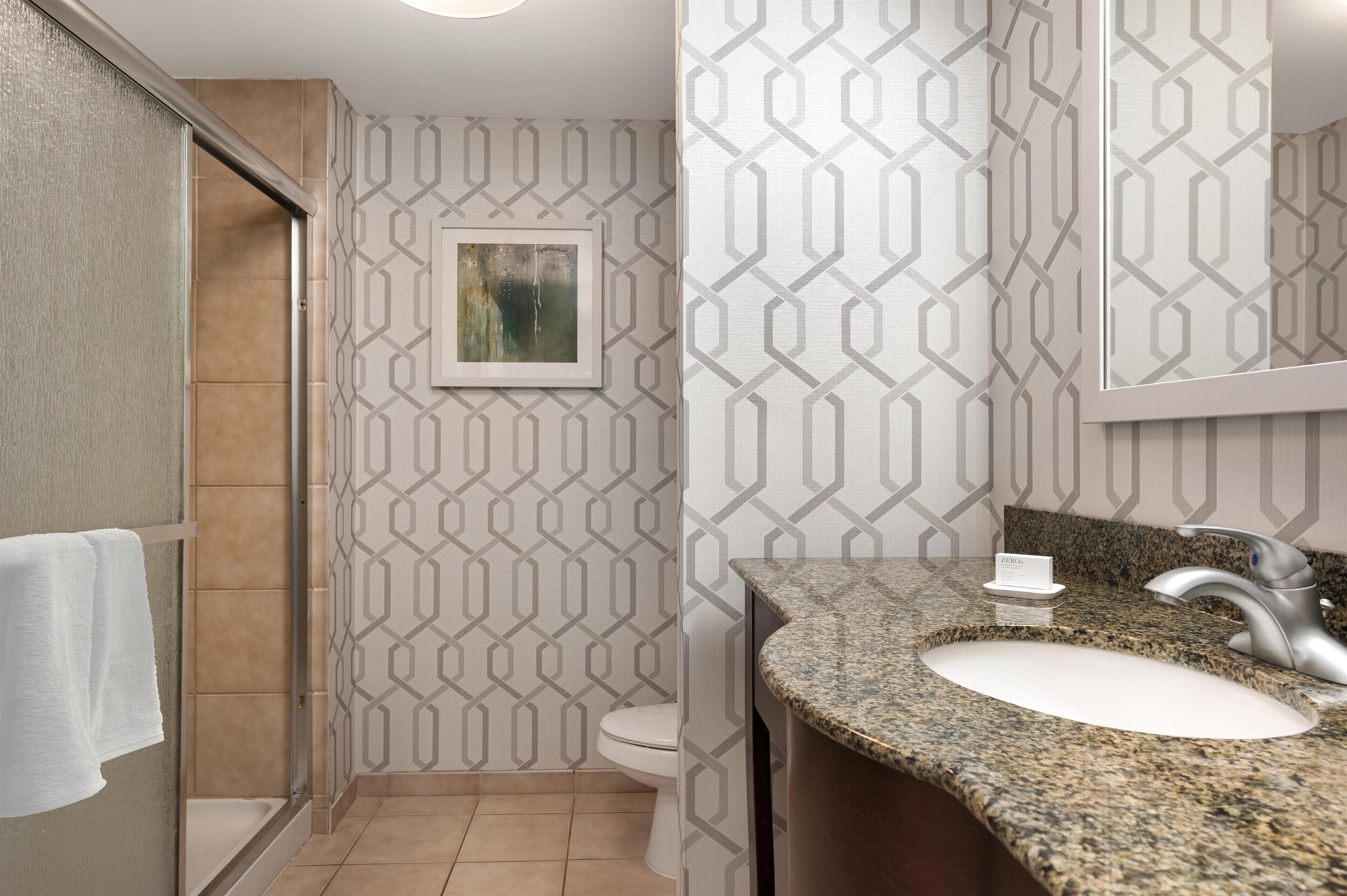 king bed | bathroom | free toiletries, hair dryer, towels